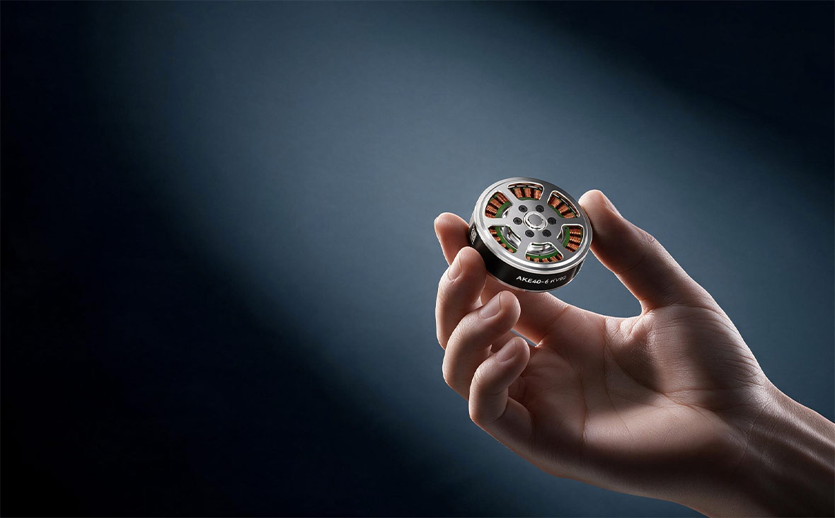 Compact AKE40 actuator held between fingertips