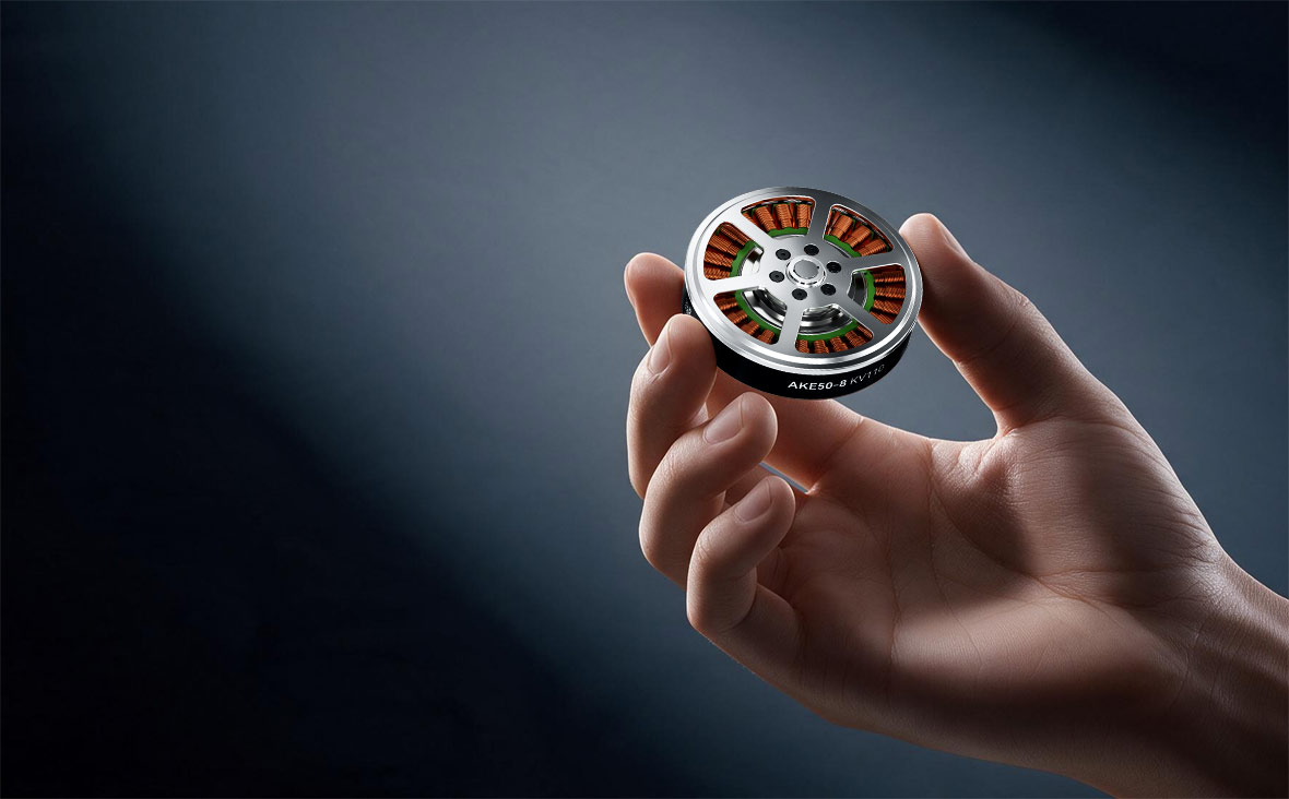 Compact AKE50 actuator held between fingertips