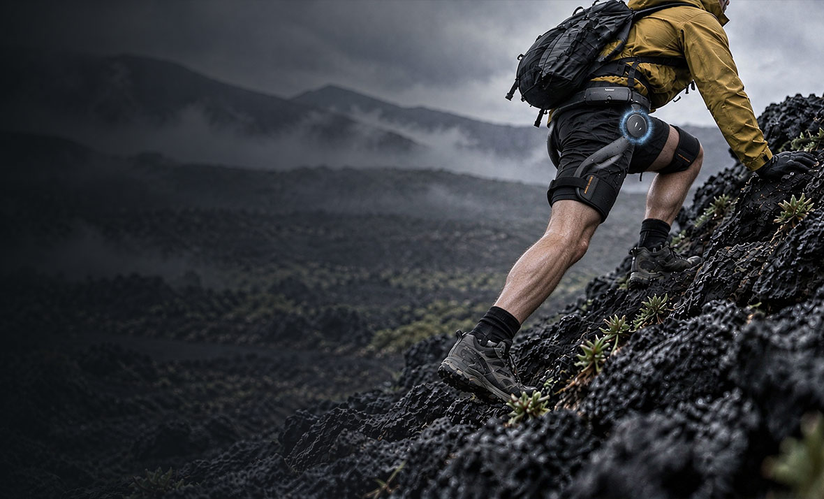 Hiker climbing with an assistive exoskeleton
